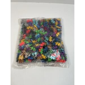 Multi-colored Mini Plus-Plus building blocks designed for interlocking play 3/4”